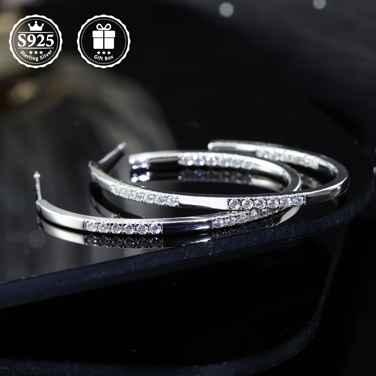 a pair of stud earrings with moissanite moissanite inlaid  925 silver material   are fashionable and elegant stud earrings for ladies which     daily or   as a   present for family   friends or lovers Product details 2