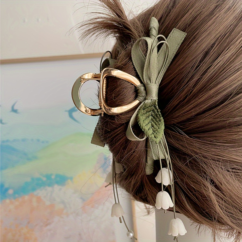 

Barrette à cheveux vintage en tissu avec fleur et nœud, motif de en lys des bois français, pièce unique, couleur assortie, pour les coiffures de sirène, à partir de 14 ans, accessoire de fête de Noël