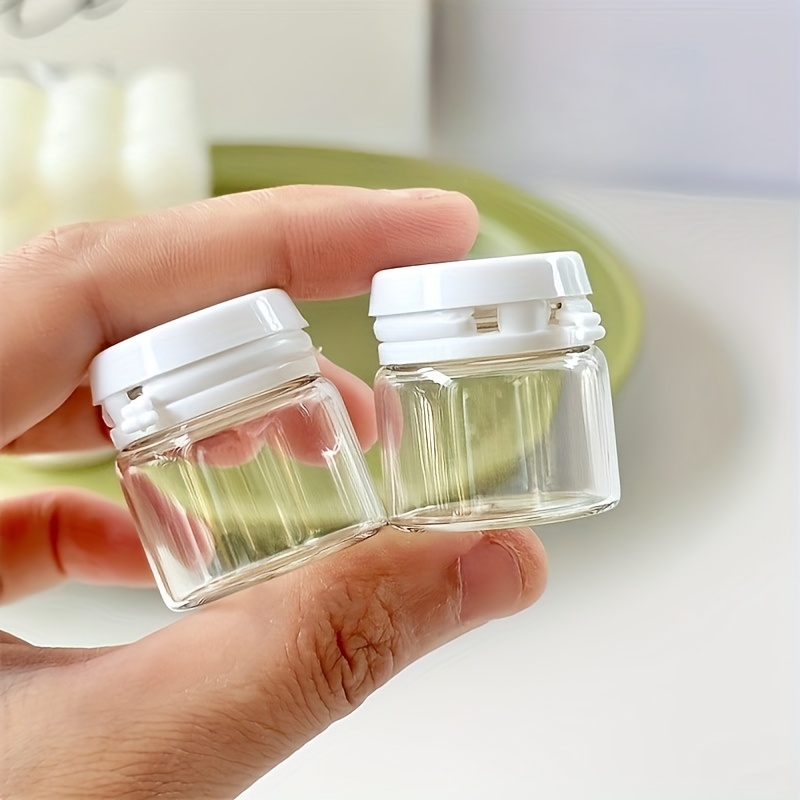 E-shop Set mit 8 Mini-Kosmetik-Flaschen, je 10 Gramm, tragbare kleine leere Glasflaschen für Reisen