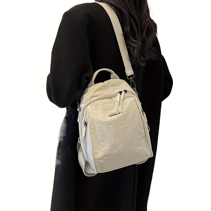 Mochila de viaje para comutadores de gran capacidad - Elegante bolso de hombro beige con múltiples compartimentos, se adapta a portátiles de 8 pulgadas, poliéster duradero, cierre con cremallera, perfecta para el trabajo o viajes, mochila para viajes, bolso versátil, accesorio moderno, construcción sólida, compartimentos amplios.