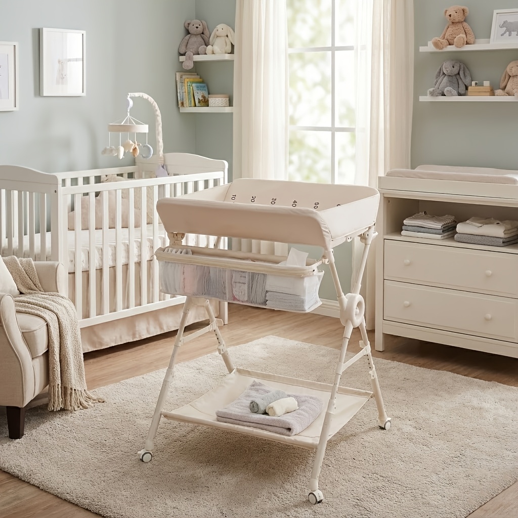 Portable Foldable Baby Changing Table with Wheels - Adjustable Height Nursery Organizer Station, Heavy-Duty Metal Foldable Diaper Changing Table with Storage Shelf, Hanging Rail & Side Basket for Nursery, Travel, for Infants &