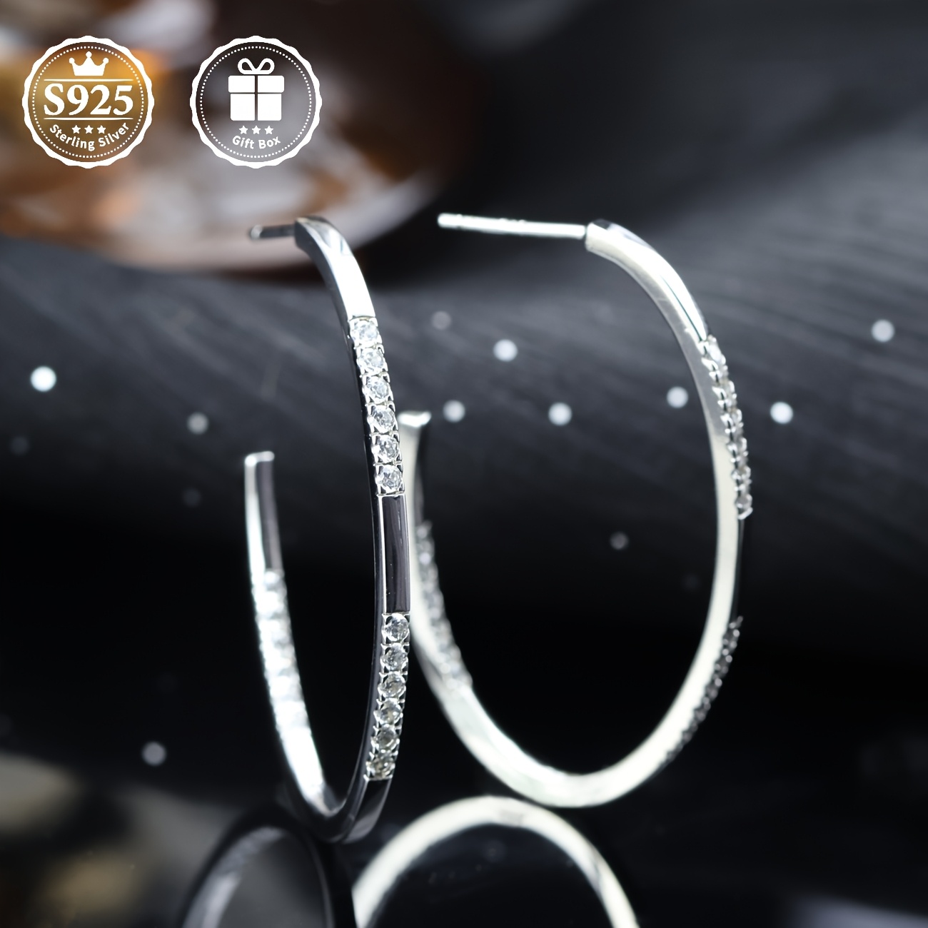 a pair of stud earrings with moissanite moissanite inlaid  925 silver material   are fashionable and elegant stud earrings for ladies which     daily or   as a   present for family   friends or lovers Product details 1