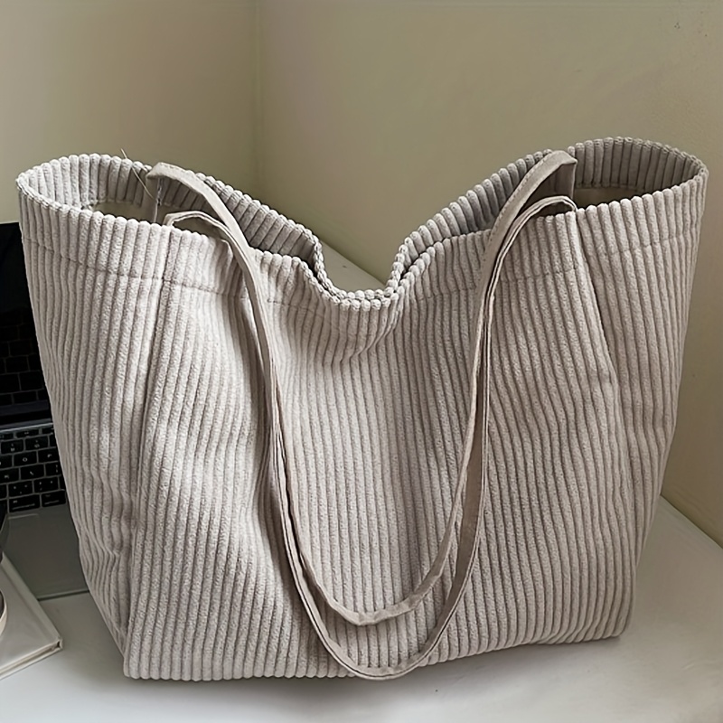 Image of A New Stylish Solid Color Corduroy Shoulder Bag For Women, Featuring A Soft Texture And Large Capacity. This Versatile And Lightweight Tote Bag Is Perfect For Shopping And