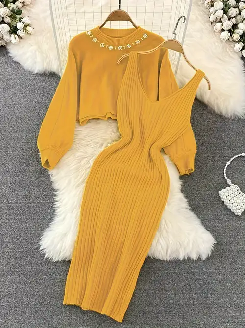 Fashion V-neck solid color sleeveless beaded knitted dress Fashion V-neck solid color sleeveless beaded knitted dress