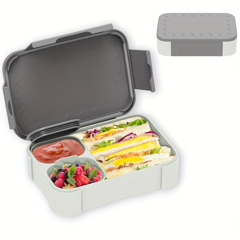 Image of A Portable Lunch Box With A 900ml Sealed Compartment, Featuring Separate Cups For Fruits, Vegetables, And Sauces Of 140ml And 80ml. Heated In The Microwave