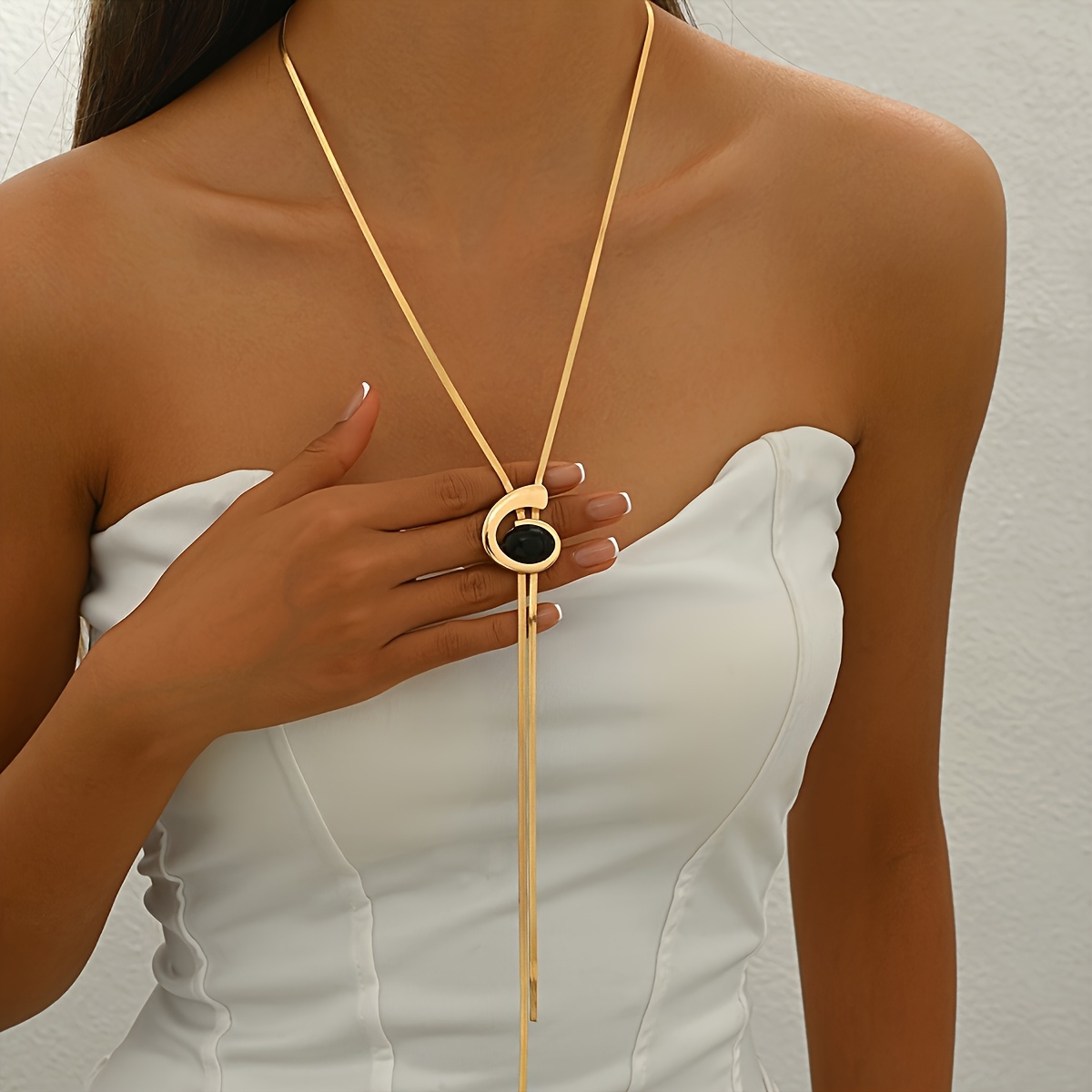 Image of A Stylish Women's Y-shaped Necklace Featuring A Black Oval Acrylic Rhinestone Spiral/snail Pendant With A Flat Snake Chain. Fashionable, Easy, Sexy, And Versatile For Everyday Wear And Parties