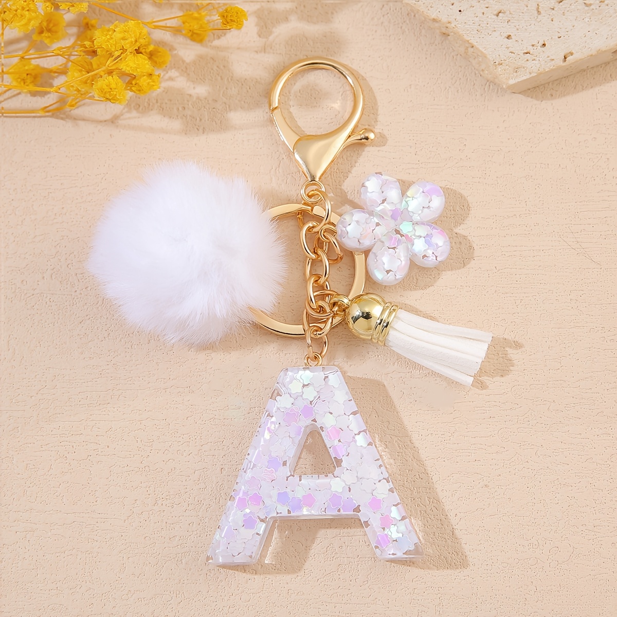 TEMU 1pc Nouveau Porte-clés Blanc Pompon Lettre Anglaise A-Z avec Pendentif à Gland de Fleur Anneau de Clé Paillettes Initial Décoration de Sac Femme