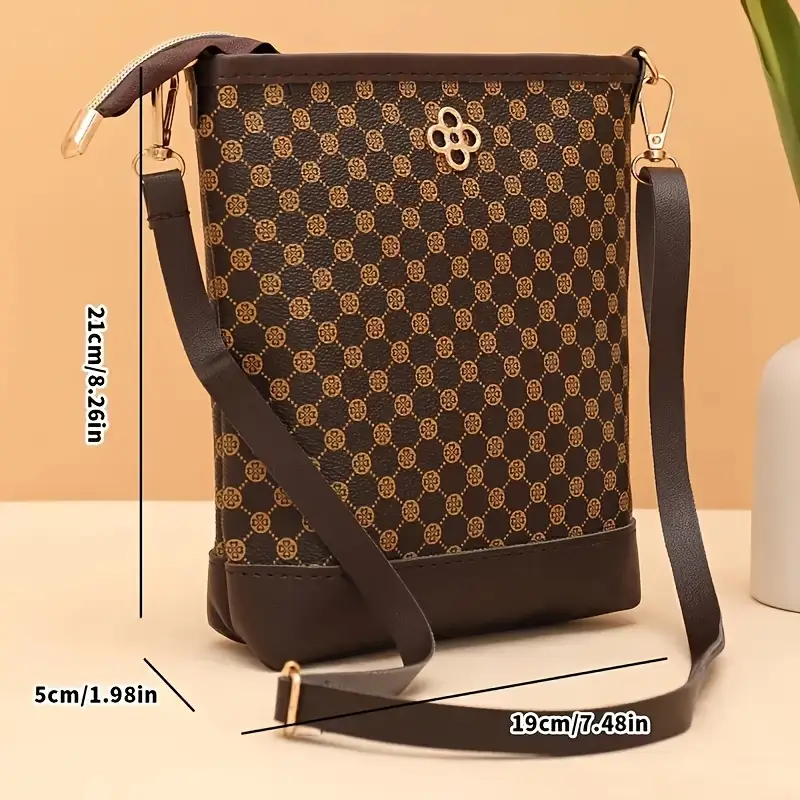 a vintage geometric patterned crossbody bag featuring a lightweight adjustable shoulder strap a zip closure polyester lining capacity and pockets for a phone and a versatile bag suitable for occasions details 2