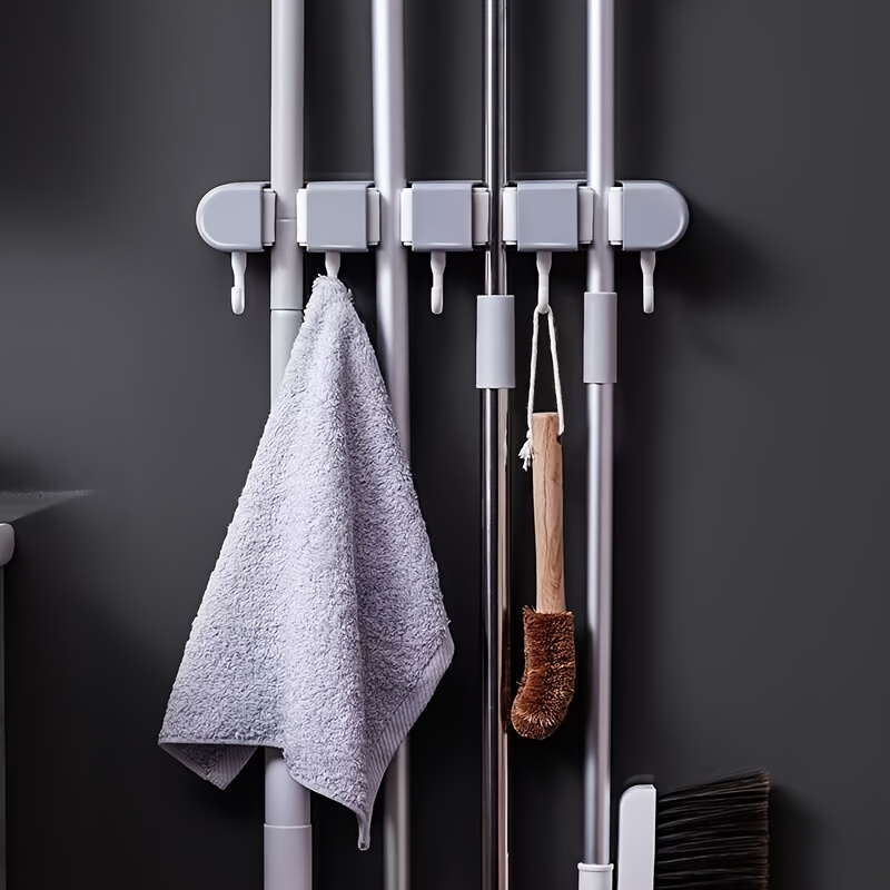 wall mounted mop and broom holder no drill   organizer with flexible silicone clips multi use plastic storage rack for bathroom   saving   sleek gray   cleaning tool holder   durable plastic rack details 1
