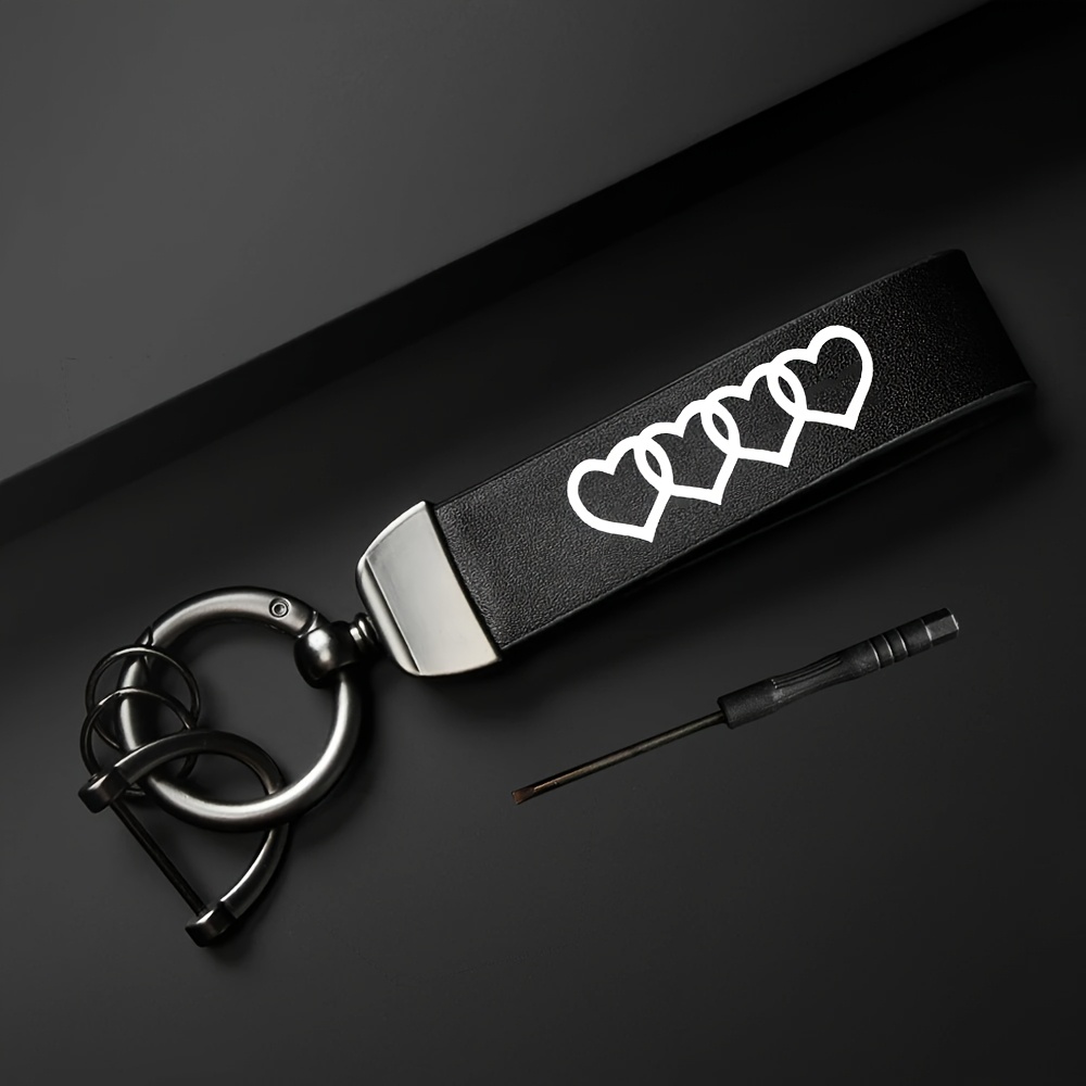 A Leather Keychain With A Durable For Car Keys - Perfect For Home And Office Decor - Stylish Interior Accessory - Minimalist Key Holder With A Heart Pattern.