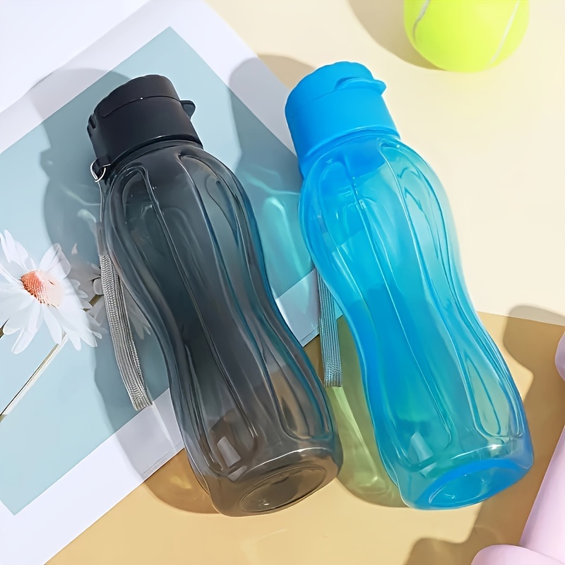 

1pc 20oz/600ml High-capacity Plastic Sports Water Bottle With Woven Carry Rope, Ergonomic Waist Design, Suitable For Outdoor Fitness, Sports, And Travel