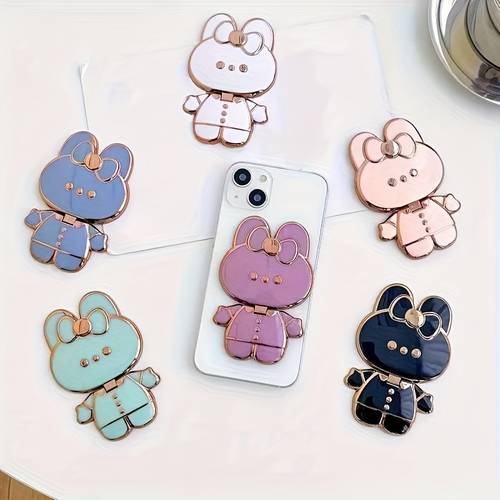 o suporte de telemóvel com espelho de maquilhagem temático de é adequado para iphones, samsung, xiaomi e vários outros smartphones, apresentando um design oco para um suporte de mesa