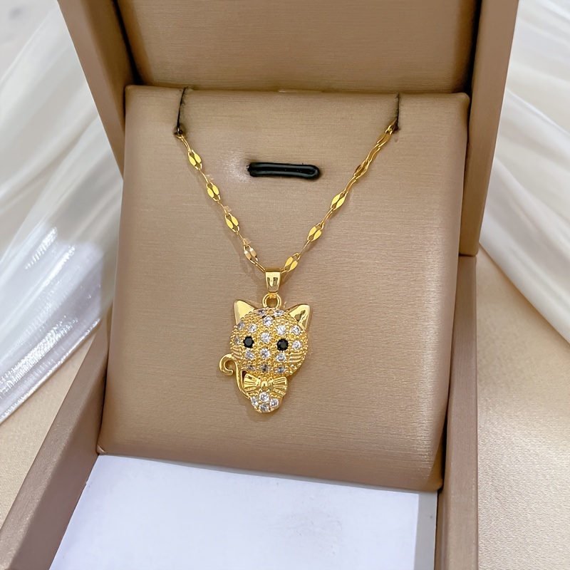 

Elegant Golden-tone Stainless Steel Necklace With Sparkling Cubic Zirconia Cat Pendant - Cute Bow Detail, Perfect Fashion Accessory For Women