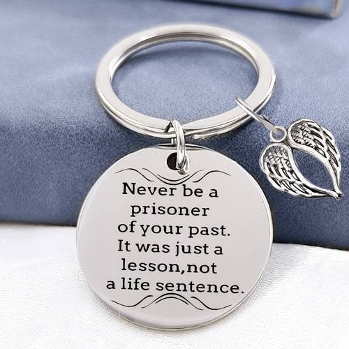 inspirational never prisoner of the past wing keychain with wing accessories is a accessory that conveys healing power a unique gift for and colleagues an inspirational round keychain
