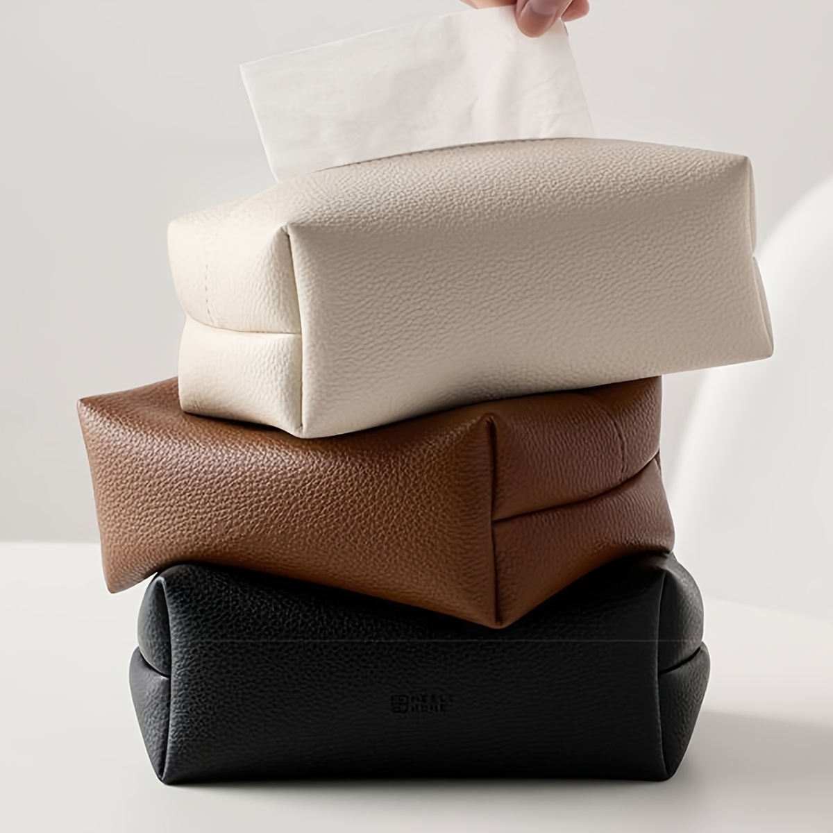 modern minimalist tissue box beige neutral colors durable   leather like material compact rectangular   room bathroom office restaurant decorative napkin storage organizer for home commercial spaces bathroom accessory   sturdy construction functional decor interior designers Product details 0