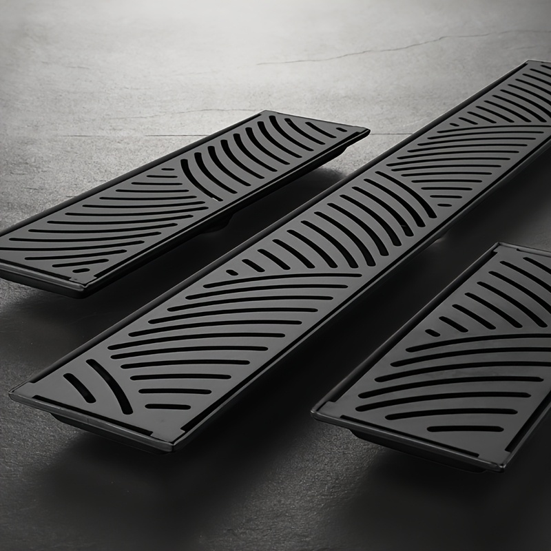 Black Stainless Long Floor Drain for Hotel Bathrooms, Rectangular Design with High Drainage Capacity, Elongated Hidden Odor-Proof Drain Featuring Wheat Ear Patterns