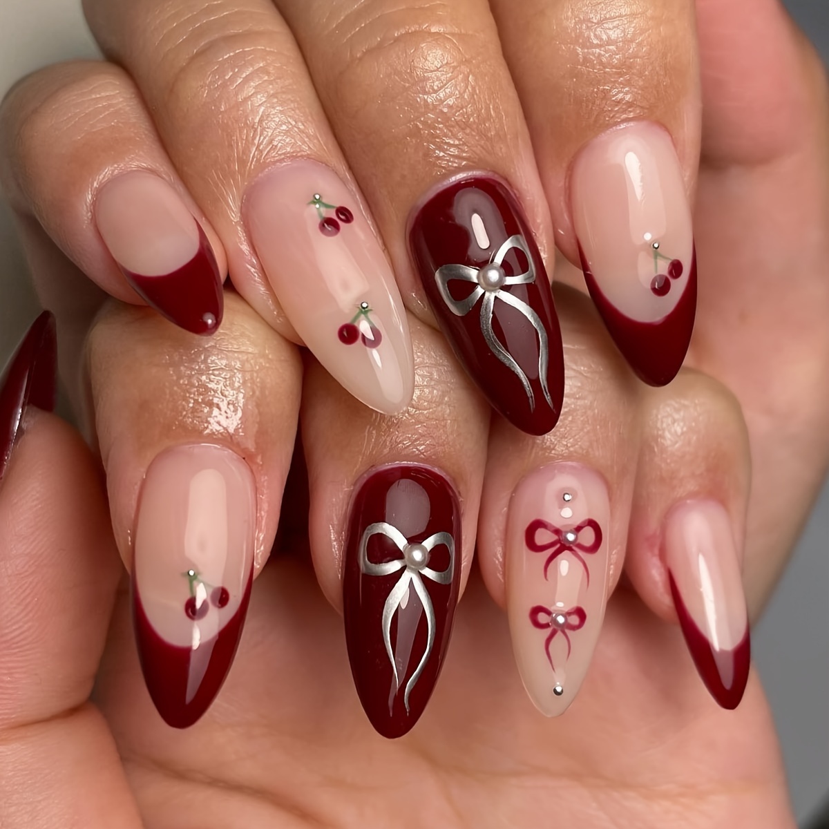 

24-piece Short Almond-shaped Nail Set With French Red Tone, Cherry And Bow Tie Design, Rhinestone Accents, And Glossy Finish - Removable Press-on False Nails With Jelly Glue And Nail File Included.