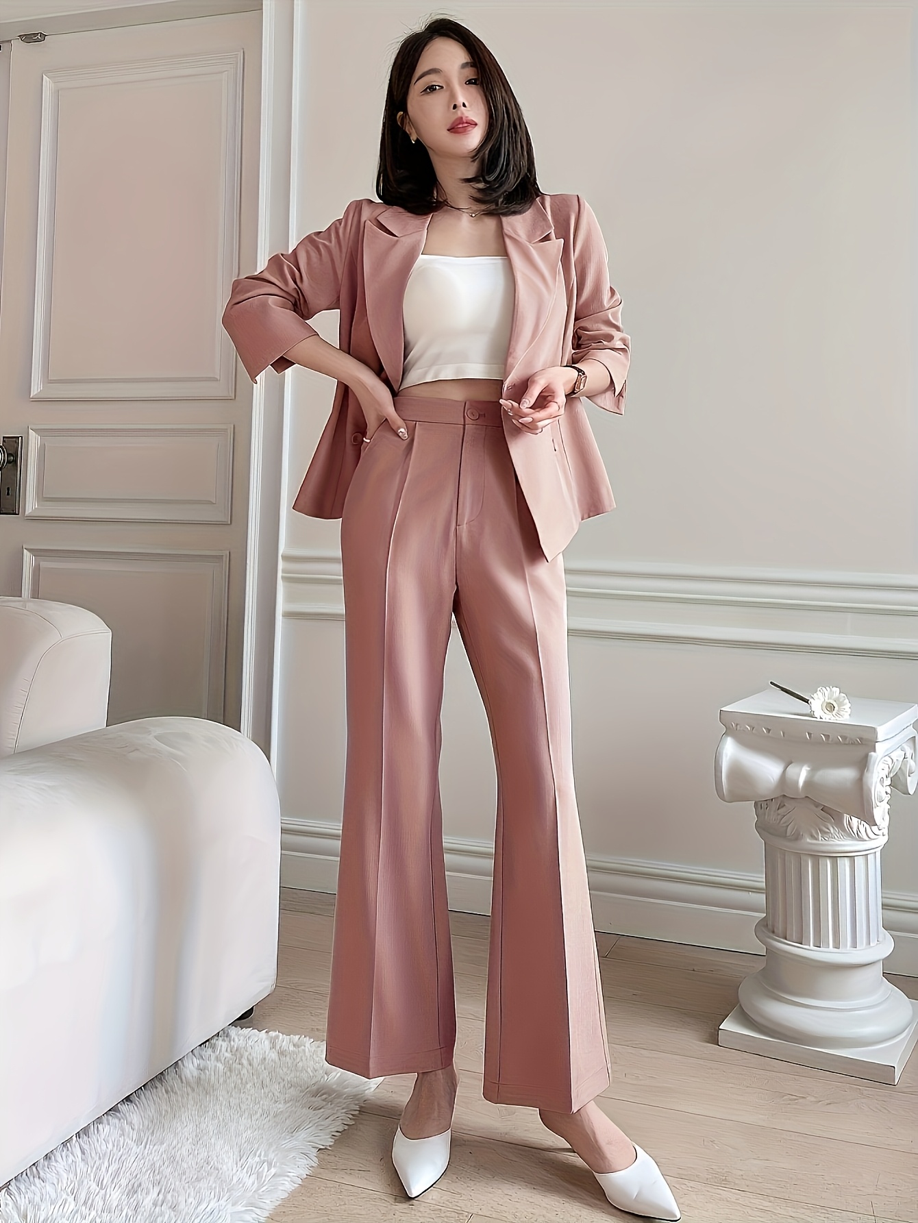 Model confidently striding in Newness Effortless Blazer Pantsuit a chic and versatile pantsuit perfect for any occasion