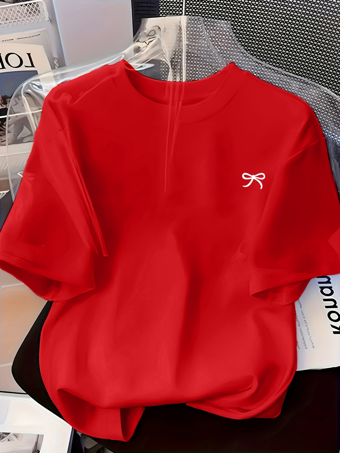   womens round neck design featuring a easy artistic bow pattern print   casual and comfortable casual attire with a versatile short sleeve t shirt