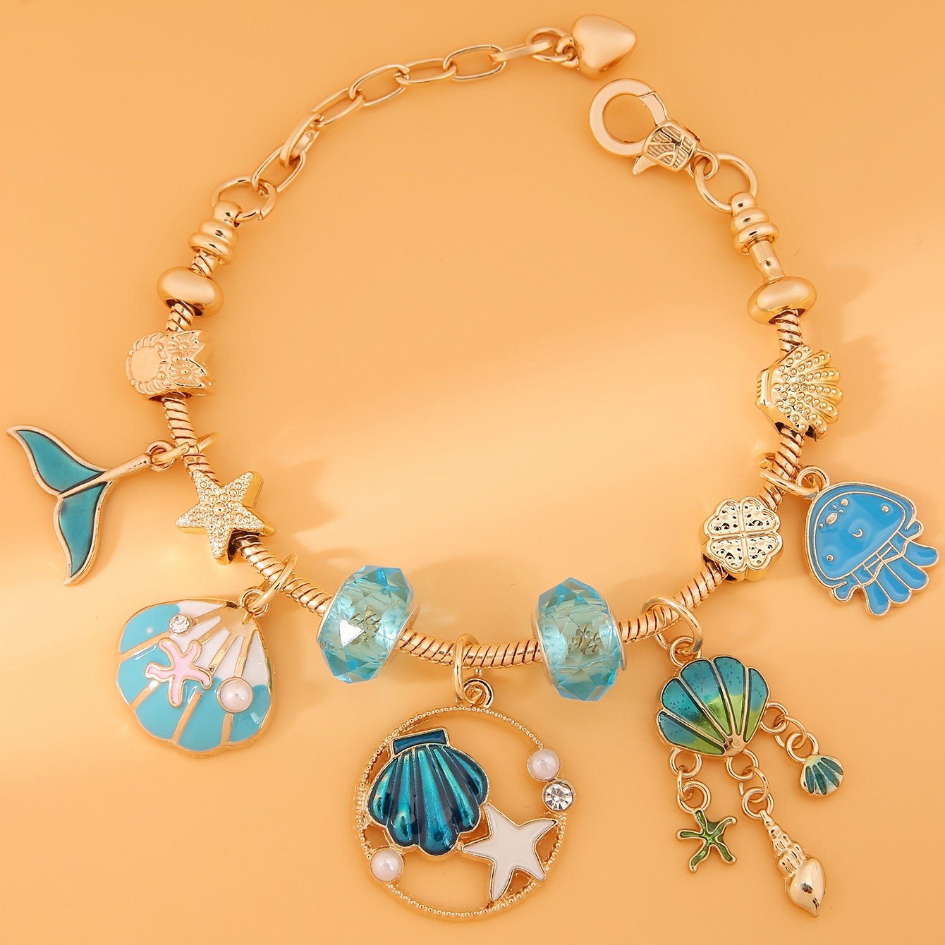 TEMU Un bracelet pendentif pour femme avec des de l'océan bleu, comprenant une queue de poisson, une , une et une étoile de mer. Fabriqué en acier