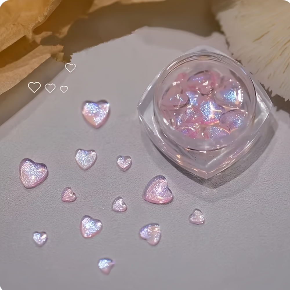 TEMU Un frasco de adornos para uñas con diamantes de en resina 3D con forma de Aurora, con una de diferentes tamaños y corazones rosas, diamantes de