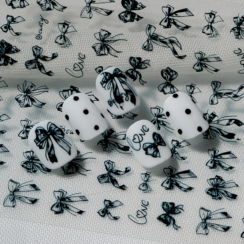 An Elegant Dark-themed Nail Sticker Featuring Embossed Texture Design, Minimalist Gothic Style, With Bow In Forms, Perfect For Personal Diy And A Dark