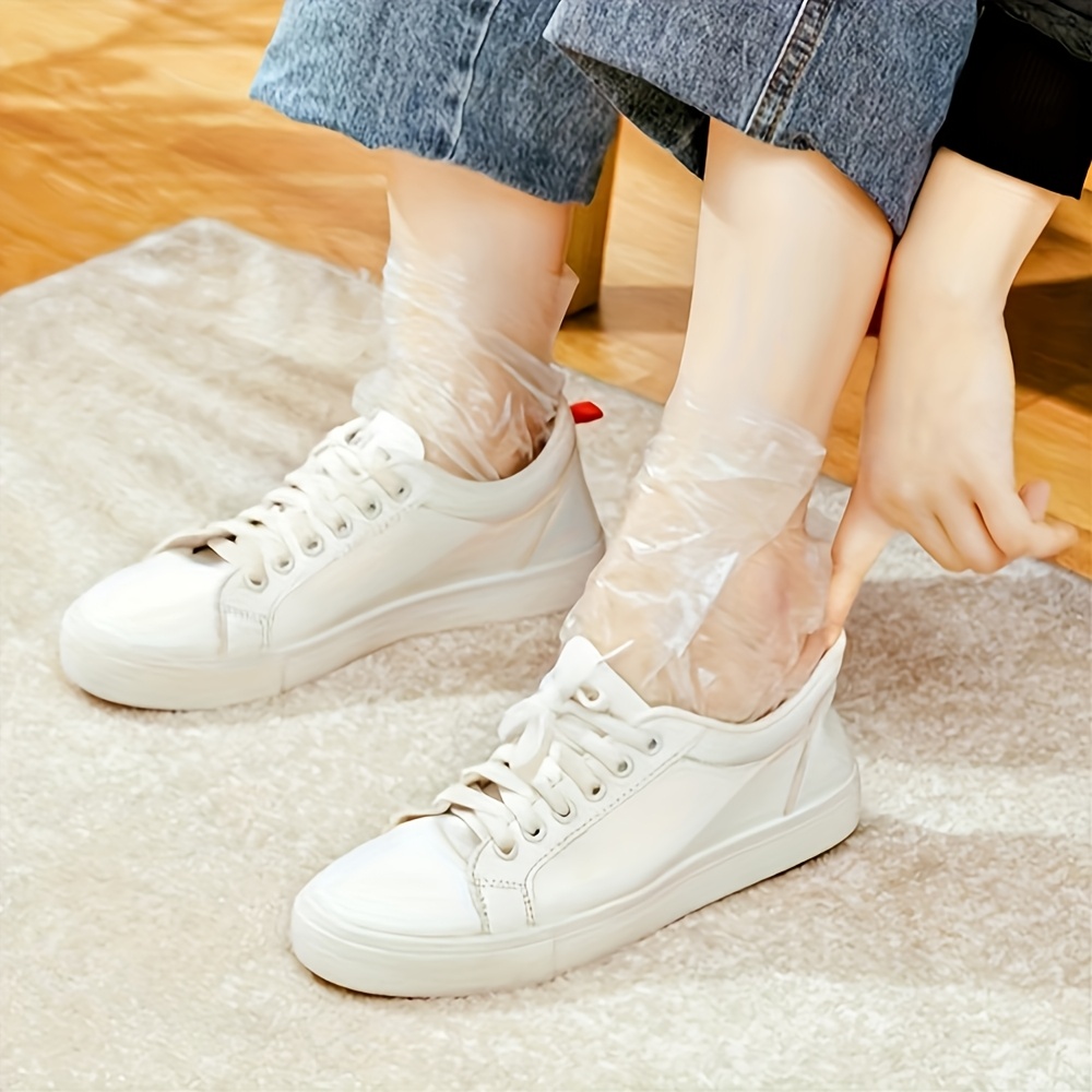 paquete 100 cubiertas desechables pies plástico transparente