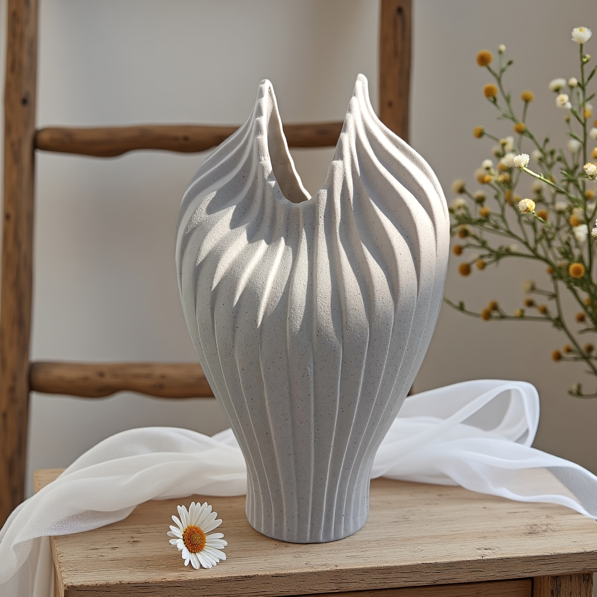 A Handcrafted Decorative Ceramic Vase with an Artistic Design Style, Featuring a Masterfully Designed Shape and Frosted Texture. Suitable for Decoration in Various Settings