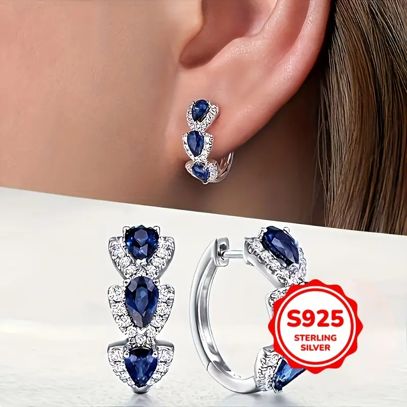 a pair of 925 sterling silver round earrings for ladies fashion rings with an elegant and luxurious style are suitable for brides engagement and wedding jewelry Product details 1