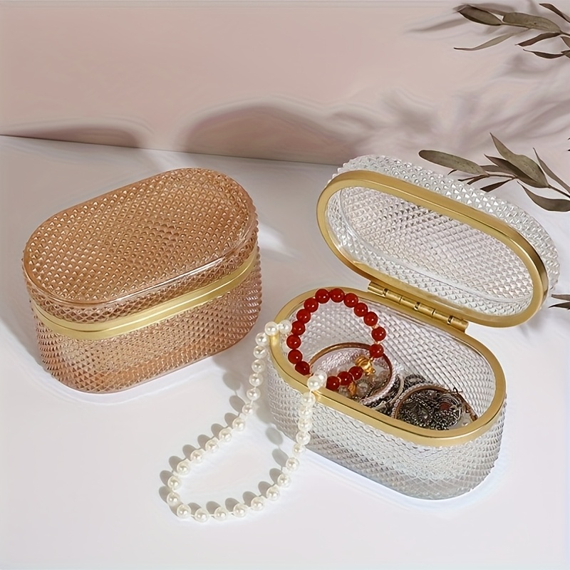modern clear glass storage box with golden accent lid dustproof oval desktop organizer for jewelry makeup pads and accessories polished   multi purpose   metal interior no power needed makeup storage contemporary style textured glass jewelry boxes Product details 2