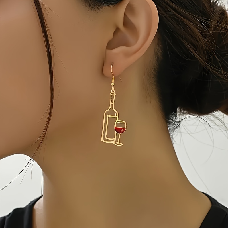 Image of A Pair Of Creatively Designed Hollow Red Wine Glasses That Are Easy And Suitable For Everyday Gifting, Featuring Unique And Interesting Earrings With A Western Niche Style