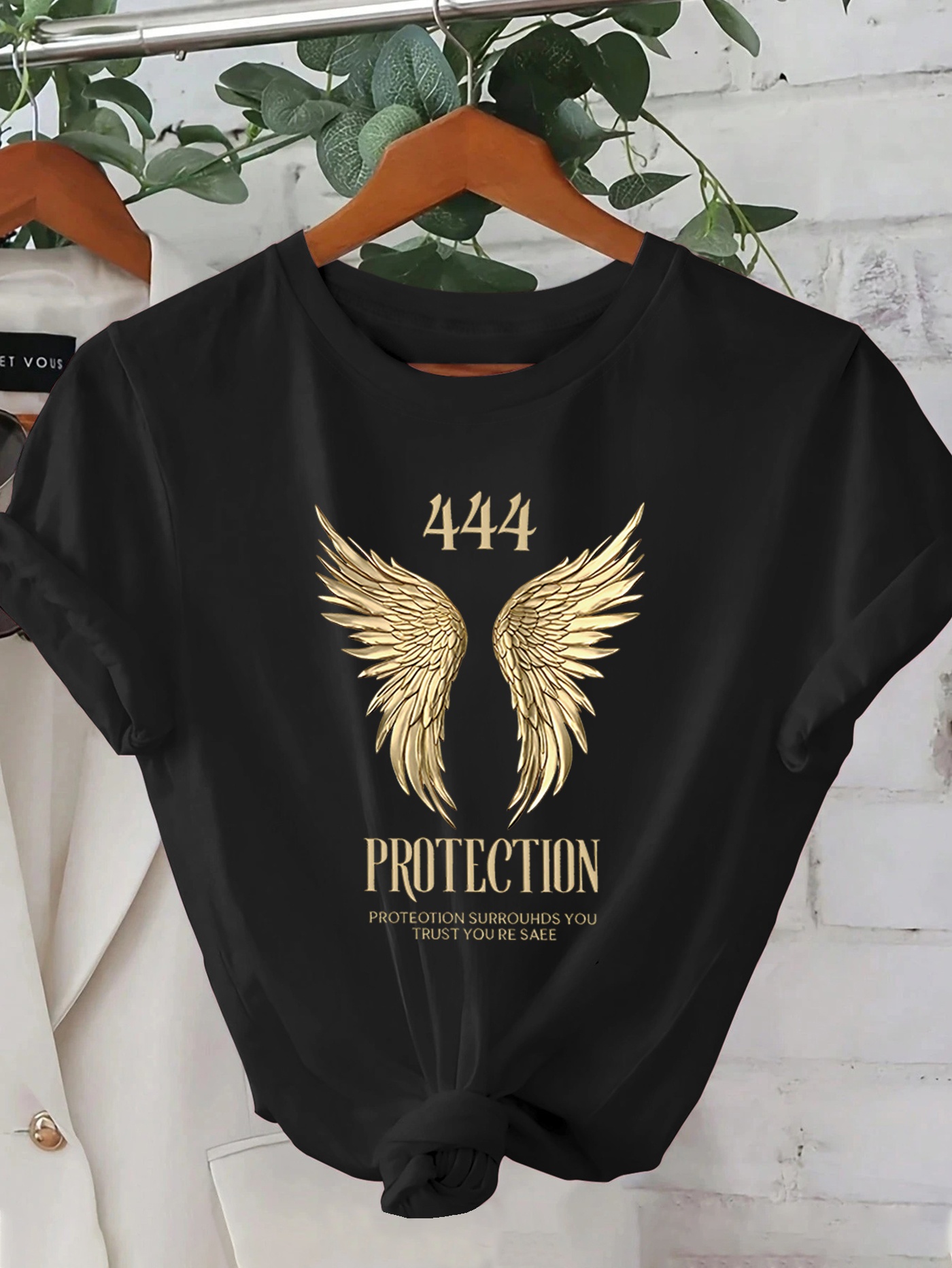 camiseta gráfica negra mujer diseño ala dorada protección Temu Chile