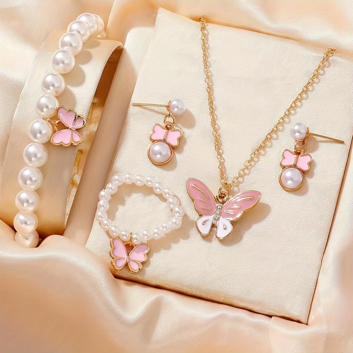 

Ensemble de 5 pièces de mode féminine avec fausses perles et papillons