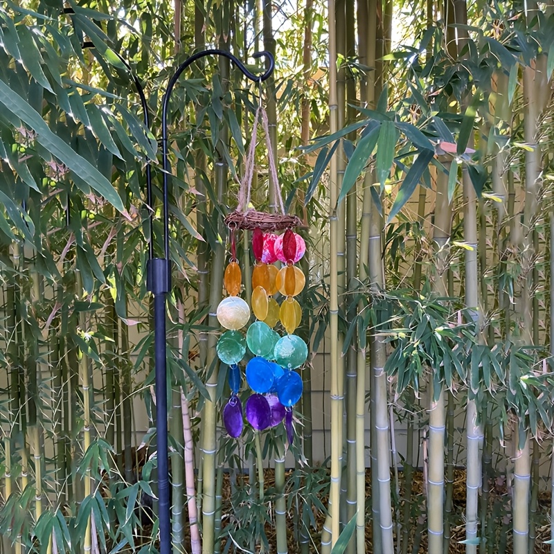 Image of Sounds Of The Seaside, Decorative Wind Chimes Made From Ocean Shells, Perfect For Indoor And Outdoor Settings, Featuring Colorful Shell Strands Draped On A Branch Wreath