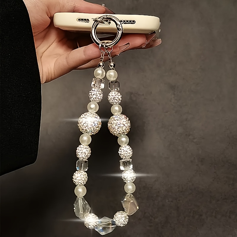 A Beaded Phone Strap With A Sparkling Rhinestone Decoration, Beautifully Handcrafted As A Universal Phone Accessory, Designed For Women