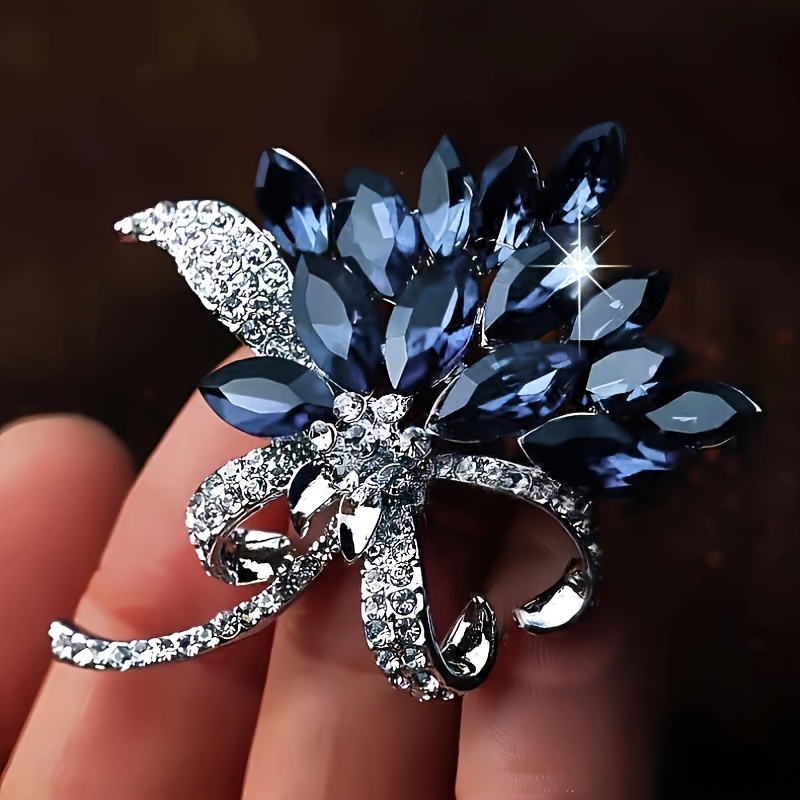 an elegant vintage style multi layered   brooch   with blue gemstones and sparkling crystals a chic   for   for parties and special occasions christmas gifts banquet   and festive celebrations