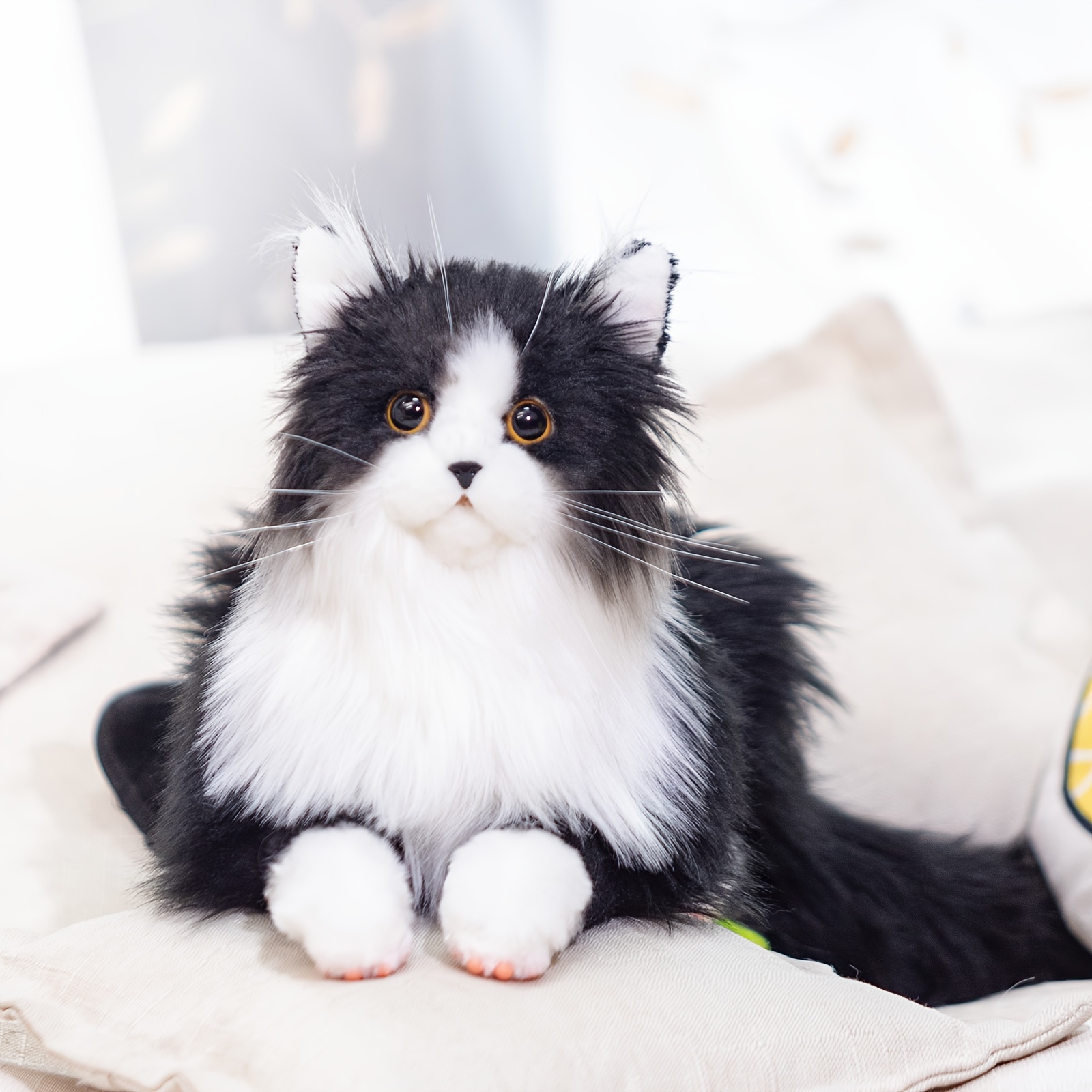 stuffed black and white cat