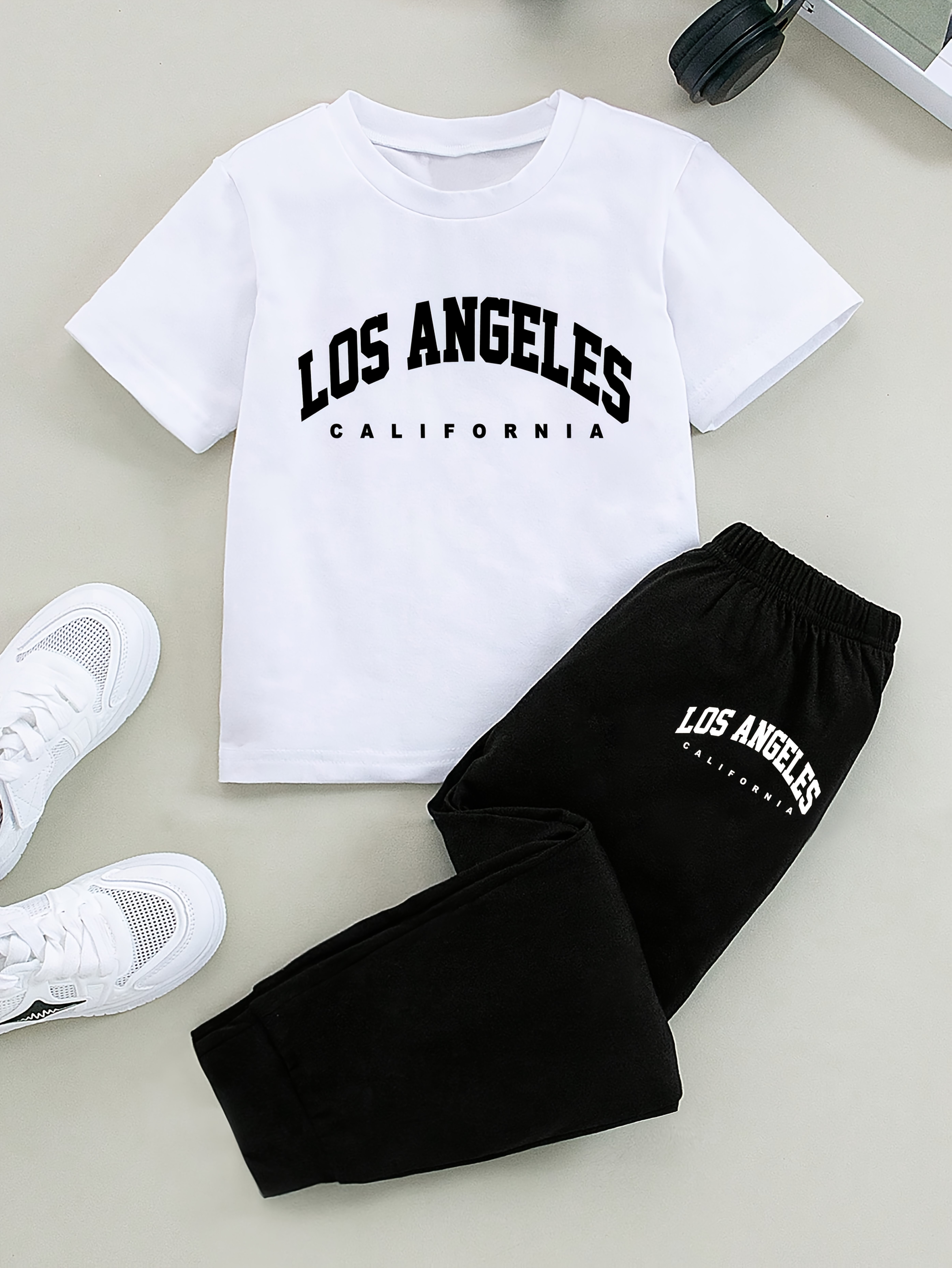 A Set of Two Pieces Featuring a Print of The Letters 'Los Angeles', Including a Stylish And Casual Short-Sleeve T-Shirt with a Round Neck And Long Pants for Boys, for Outdoor