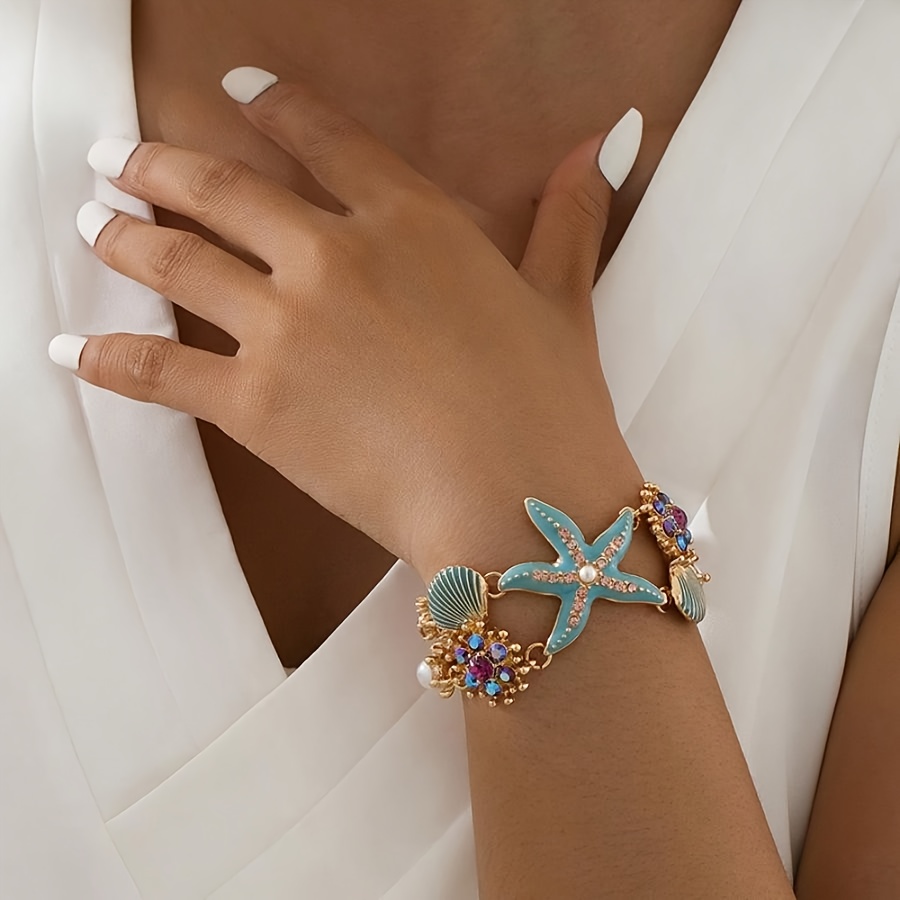 One gorgeous starfish pendant bracelet with shell details and sea coral beads suitable for beach daily wear and ocean vacation style