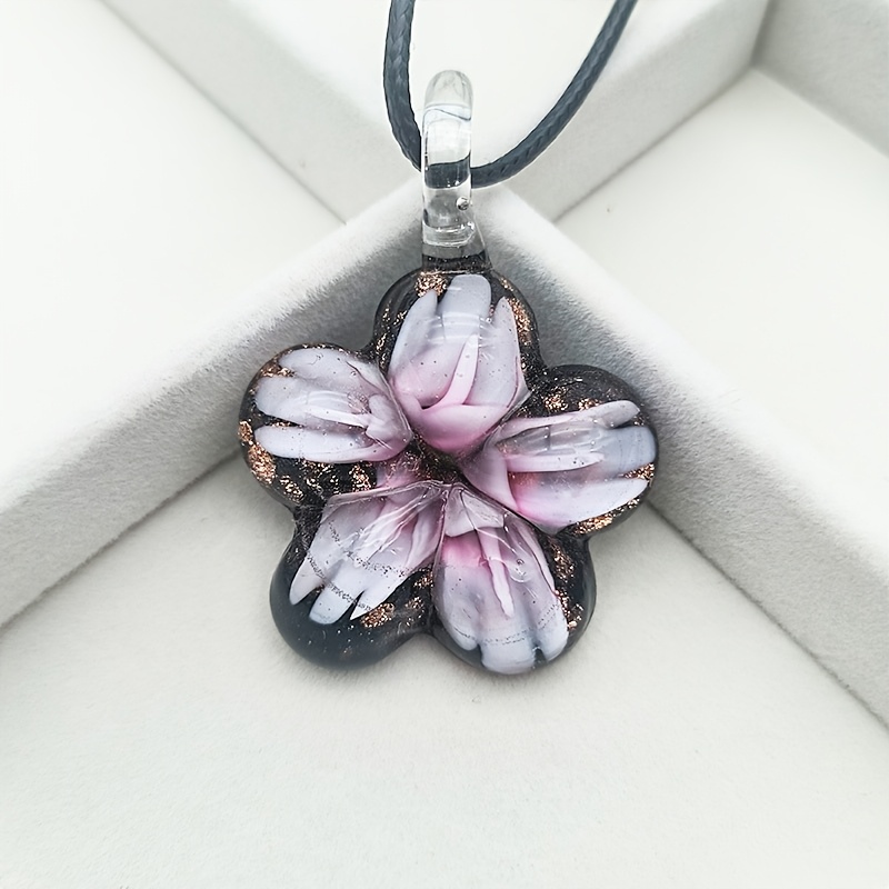 Glass Pendant Necklace on Floral Background for Daily Occasion