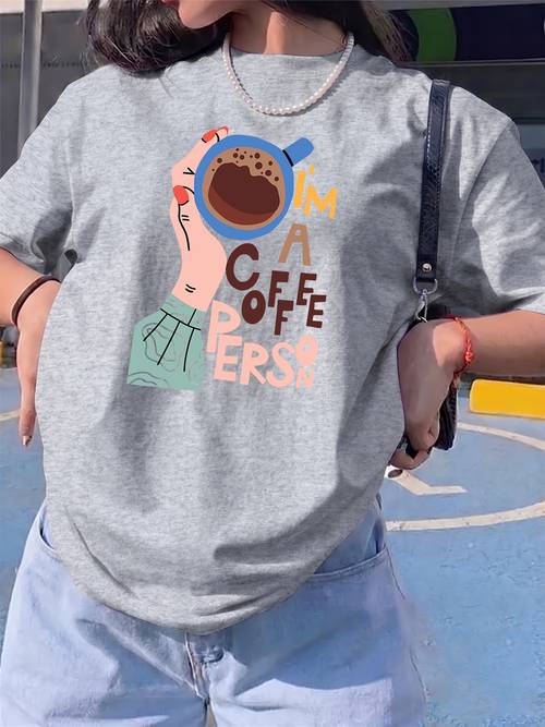 holding a coffee cup with colorful letter prints womens comfortable clothing for short sleeve round neck t shirt womens top casual elegant blouse suitable for daily wear holidays and outdoor