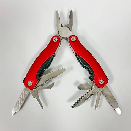 nine in one portable multifunctional folding pliers a compact camping and outdoor survival tool that a screwdriver and bottle opener made of metal and plastic materials requires no electricity