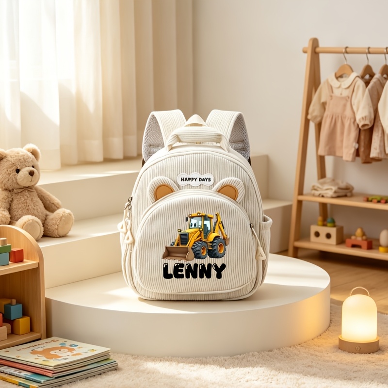 TEMU Sac à dos personnalisable avec nom, motif dessin de pelleteuse de chantier et oreilles d'. La personnalisation du nom ajoute commémorative