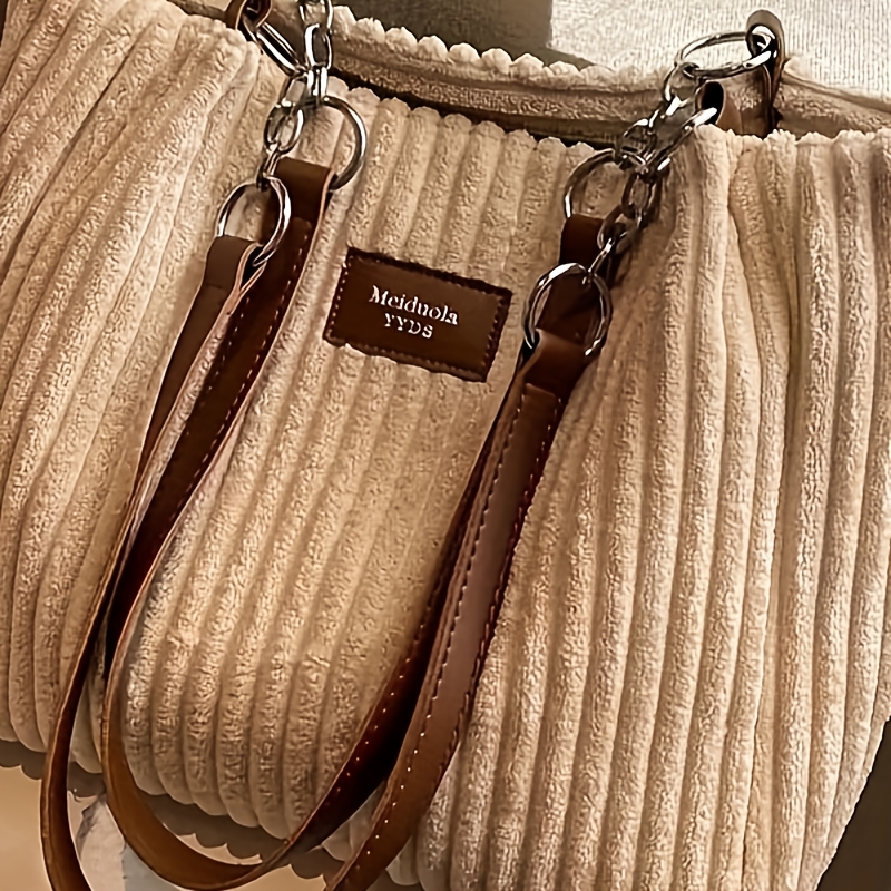 

An Elegant Corduroy Handbag For Women, Featuring A Chain Shoulder Strap, Spacious Design, Daily Commuting, With A Polyester Lining, Zip Closure, No Prints, No Fur, In Black, , Khaki, And Green.