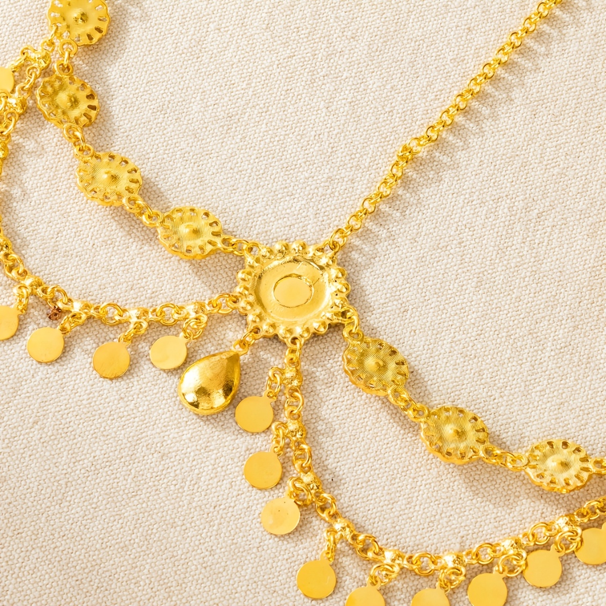 Intricate Carved Forehead Adornment with Golden Coins