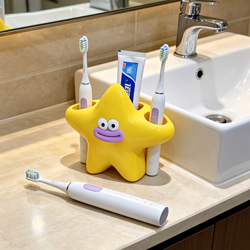 Image of The Cute And Creative Double-head Toothbrush Holder With A And Is Adorable And Practical. It Features 3 Slots, Accommodating 2 Electric Toothbrushes And 1 Tube Of Toothpaste, And Its Incredibly Cute