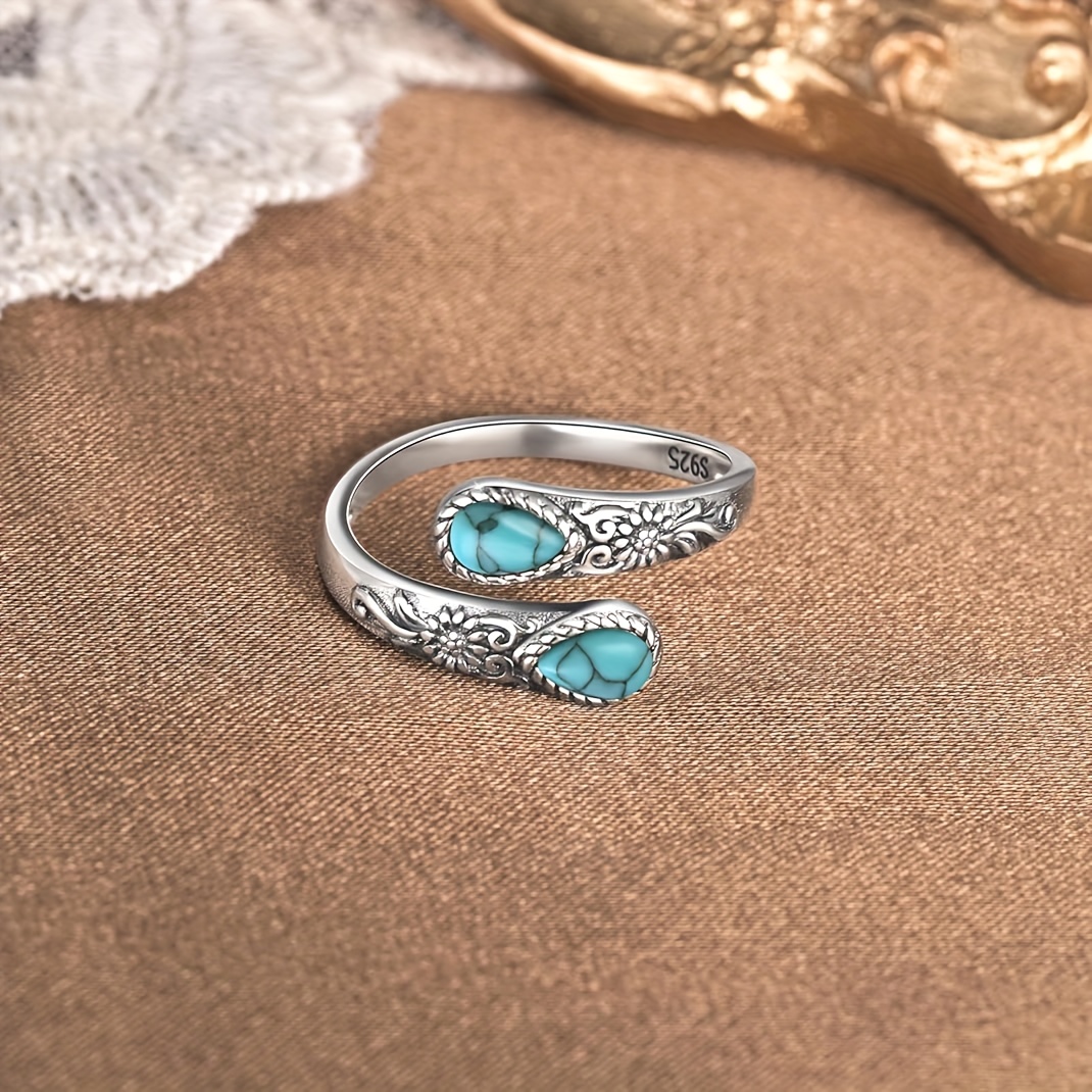 TEMU Un beau anneau avec un design délicat de marguerite, fabriqué en argent S925 et de deux magnifiques pierres turquoise de goutte de . Cet anneau