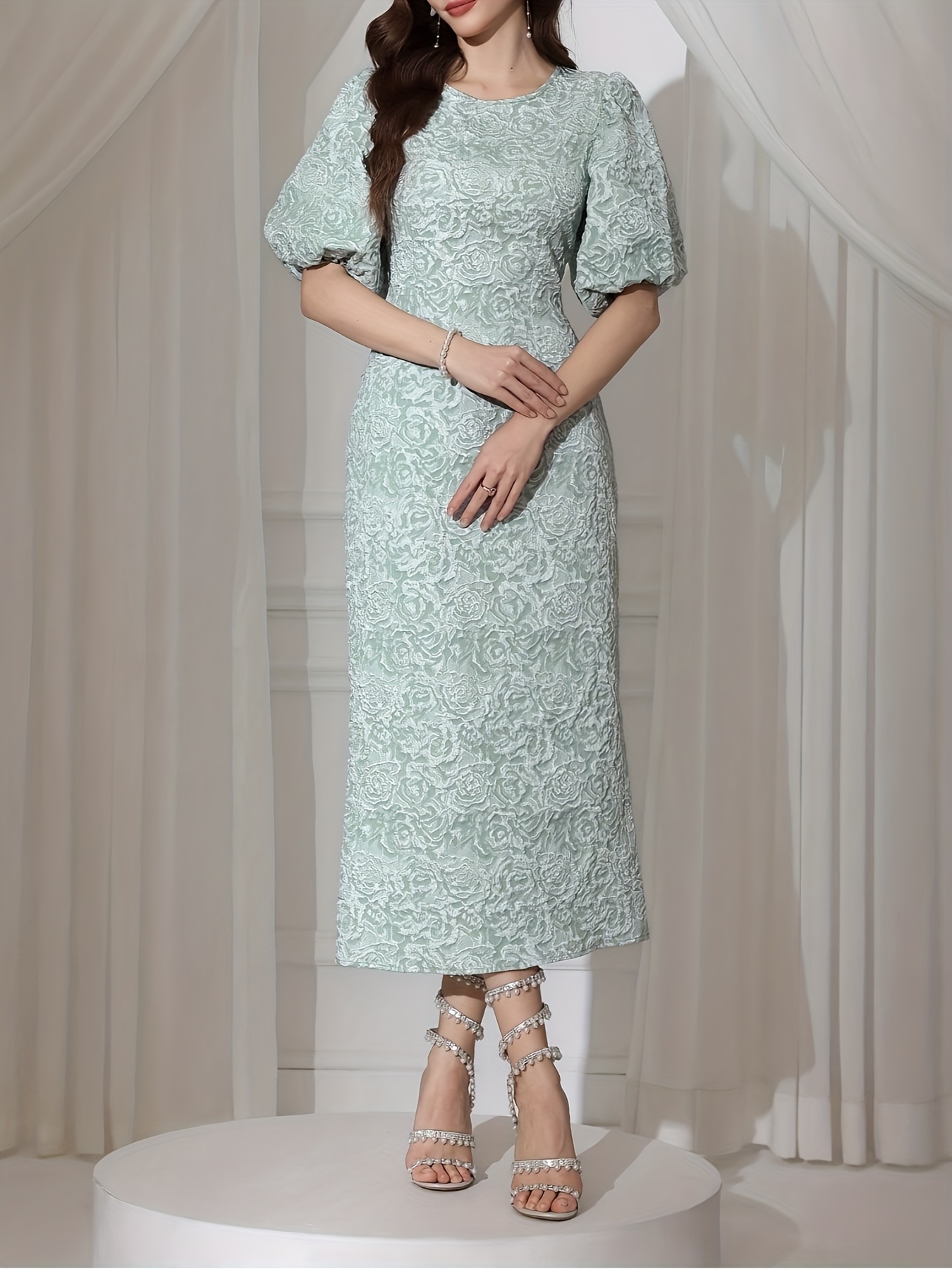 Rosebud Textured Floral Midi Dress in blush pink showcasing puff sleeves and ruffled hem