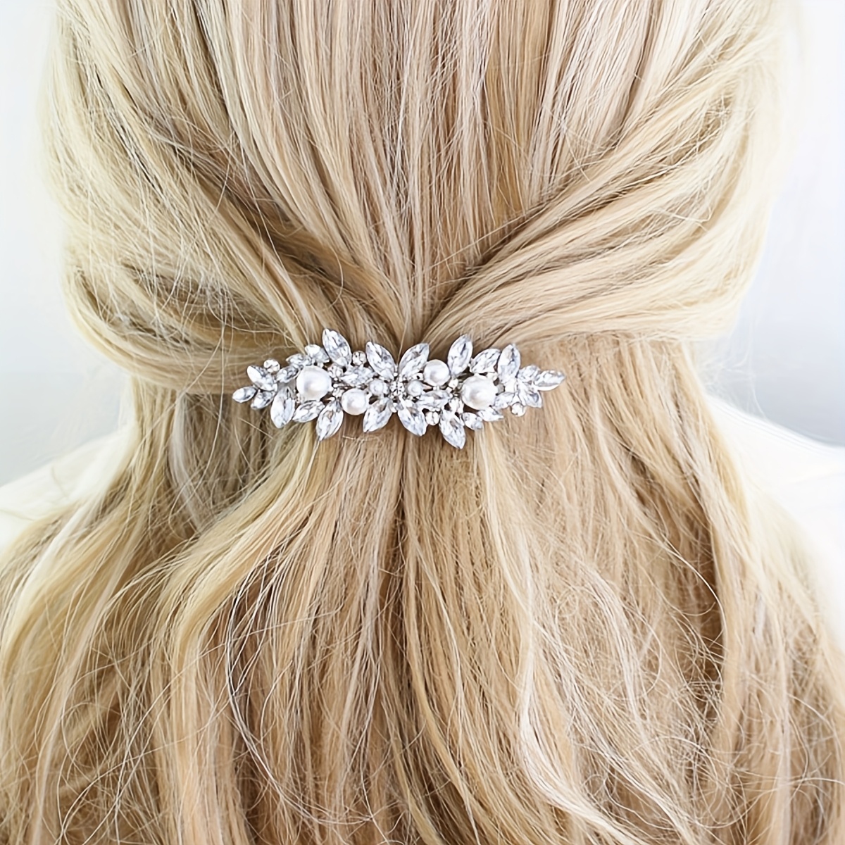 

A Stylish And Elegant Hair Clip With A , Featuring A Shape And Sparkling , Bridal Evening Gowns.