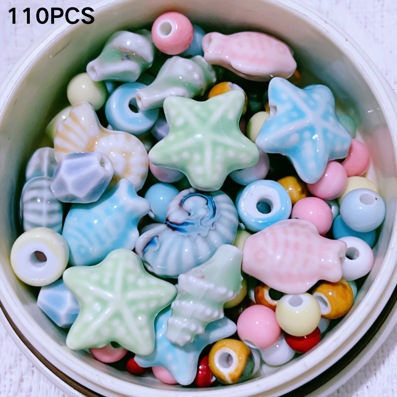 E-shop 110-teiliges Set aus gemischten Keramikperlen in verschiedenen Formen und Farben im Meeresstil – ideal für DIY-Armbänder, Halsketten,